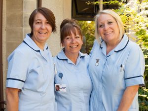 3 smiling Dorothy House nurses