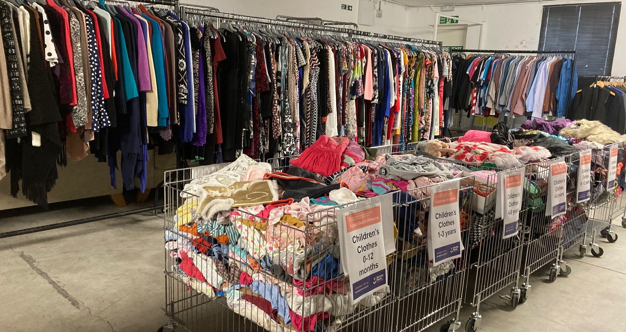 Clothing hanging on rails at the Warehouse sale