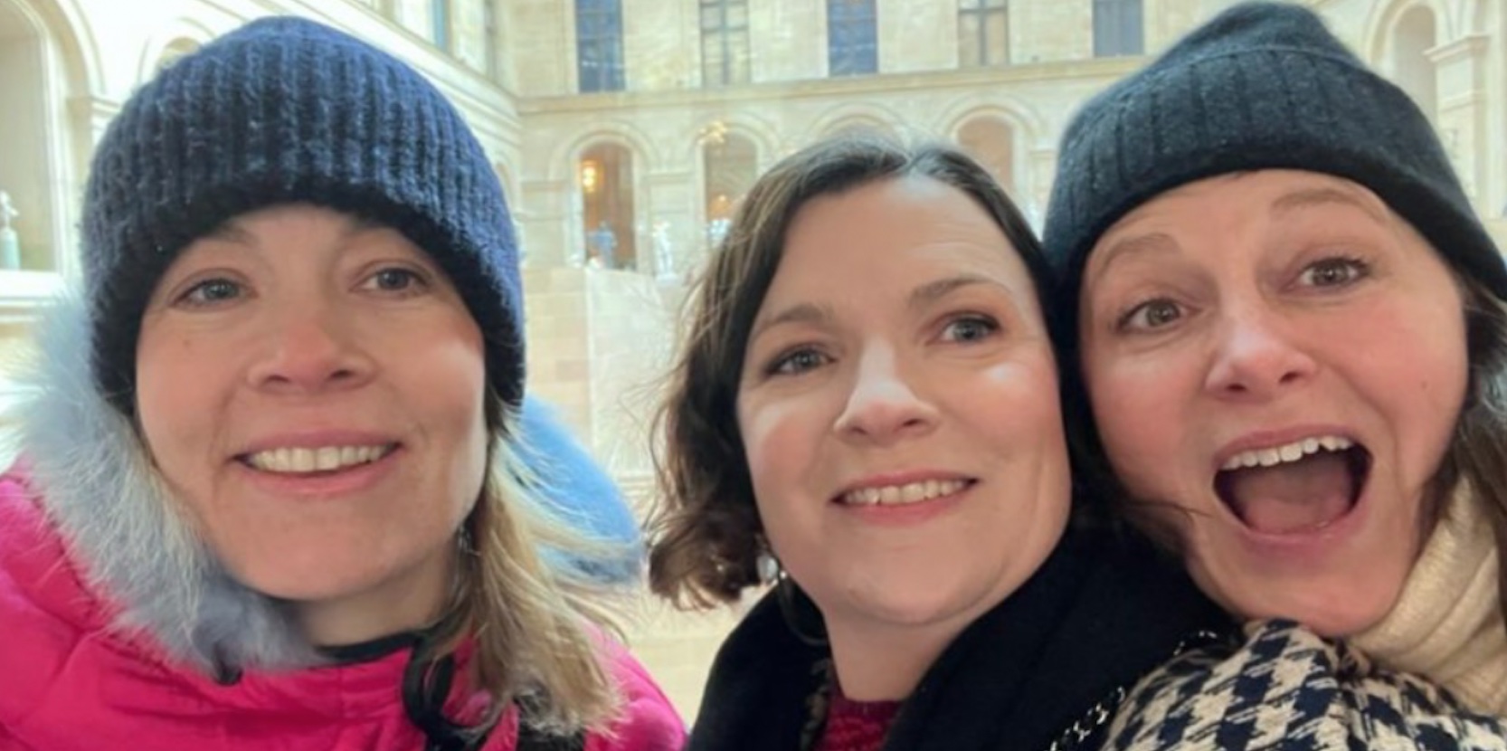 Three women smiling