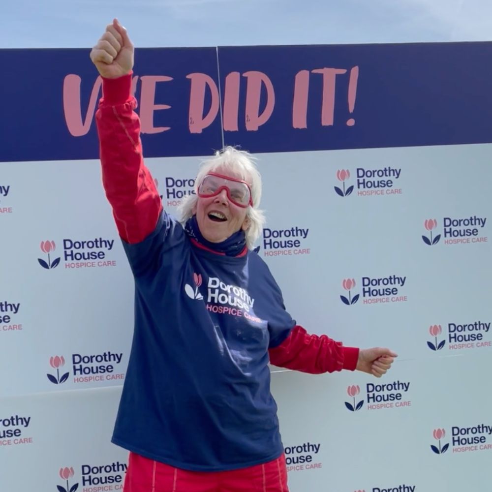 Dorothy House Wingwalker supporter punching the air after completing Wingwalk